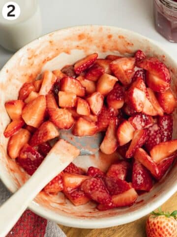strawberries macerating with sugar and strawberry preserves.