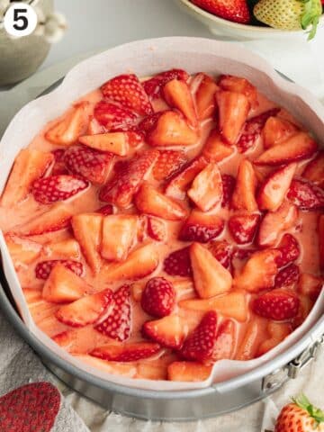 a layer of macerated strawberries on top of cake batter before baking.