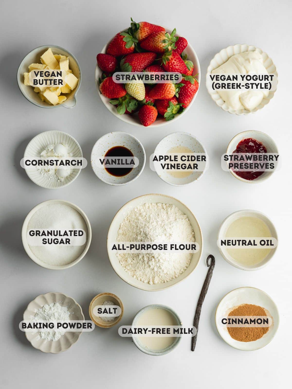 ingredients for strawberry crumb cake measured out in bowls.