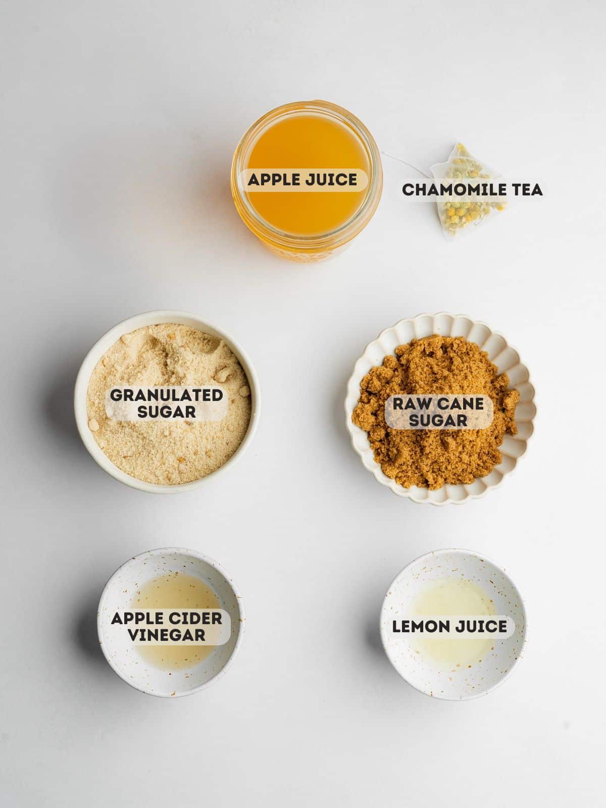 ingredients for vegan honey measured out in bowls on a gray surface.