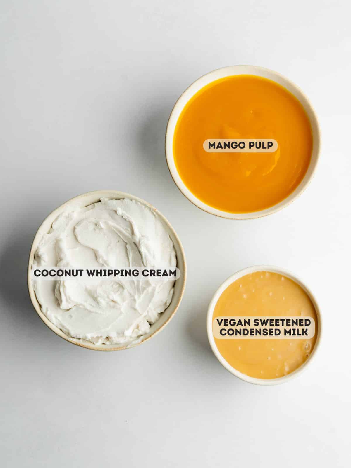 ingredients for mango ice cream measured out in bowls.