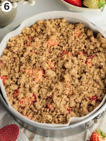 strawberry crumb cake in a prepared pan before baking.