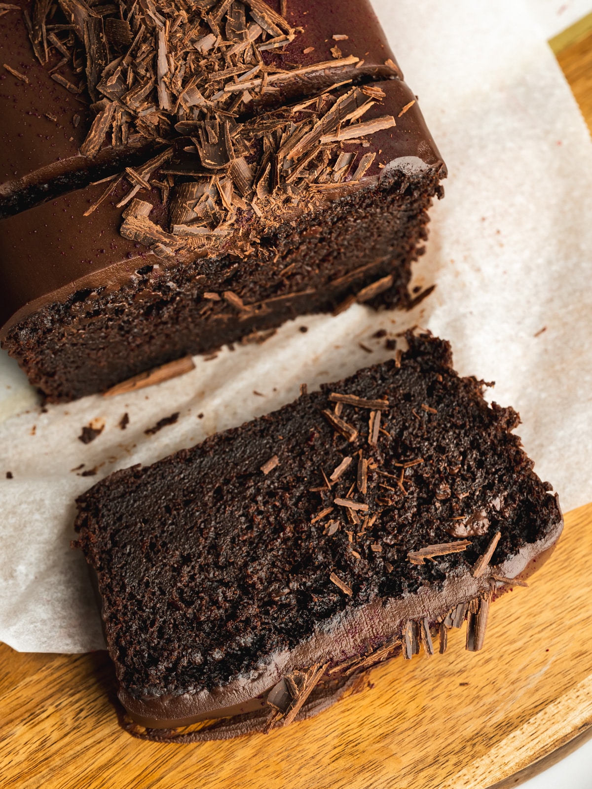 sliced chocolate loaf with ganache topping.