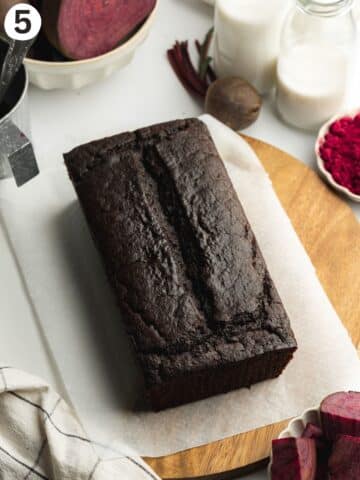 beetroot chocolate loaf cake cooling on a tray.