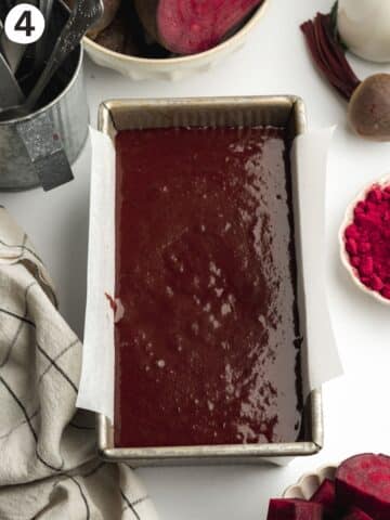 loaf pan filled with beetroot chocolate cake batter before baking.