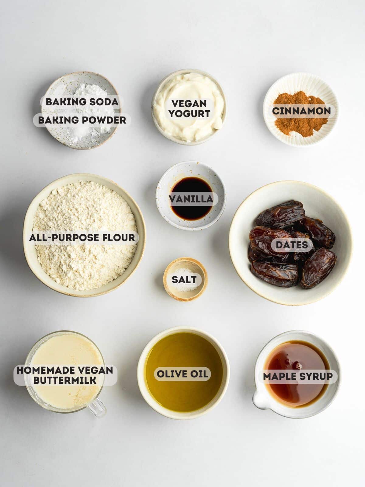 ingredients for date cake measured out in bowls.