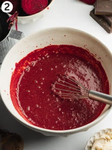 wet ingredients for beetroot brownies whisked into a smooth paste in a ceramic bowl.