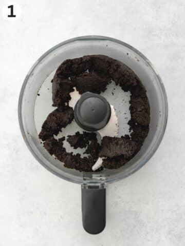 oreo cookie crust blended in a food processor jug.