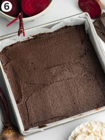 beetroot brownie batter smoothed out in a square pan before baking.