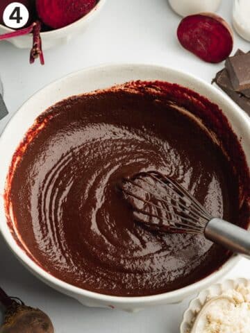 melted dark chocolate whisked into beetroot puree, yogurt, sugar, espresso, and vanilla to form a smooth paste in a bowl.