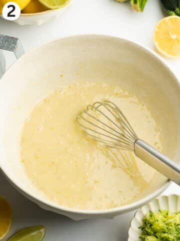 wet ingredients for zucchini bread whisked until smooth in a large ceramic bowl.