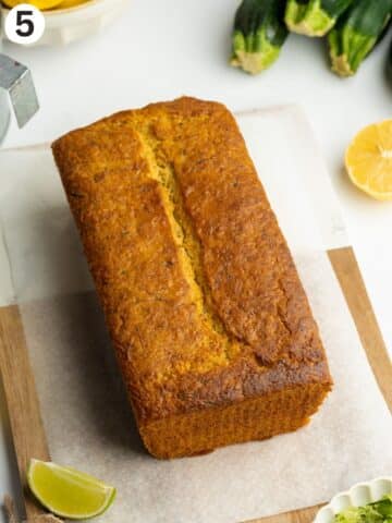 zucchini bread on a wooden board before icing.