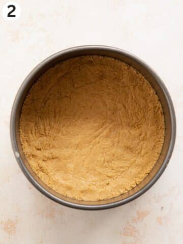 digestive biscuit base pressed into the bottom of a cheesecake tin.