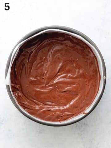 chocolate cherry cheesecake filling in a lined pan before going into the fridge to chill.