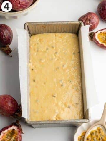 a loaf pan with passion fruit cake batter before baking.