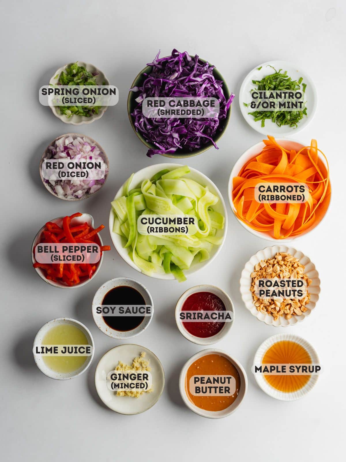 ingredients for thai crunch salad prepped and measured out in bowls.