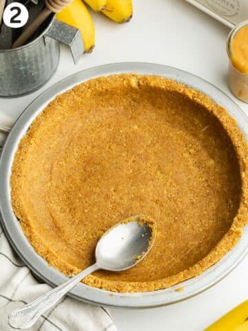 cookie crust pressed into a lined pie tin.