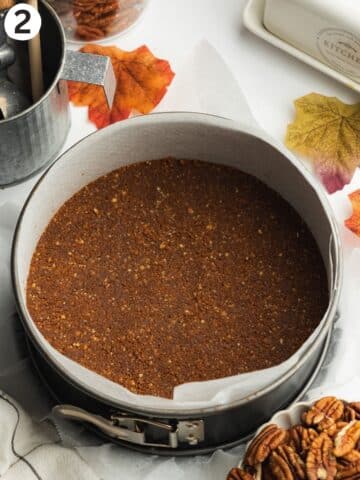 cookie crust pressed into a lined springform pan.