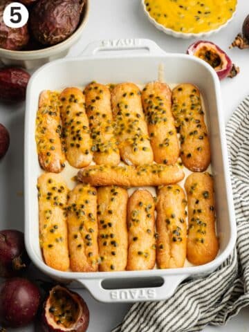 ladyfingers soaked in passion fruit syrup arranged in a dish.