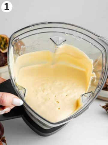 passion fruit curd and mascarpone blended until creamy in a blender jug.