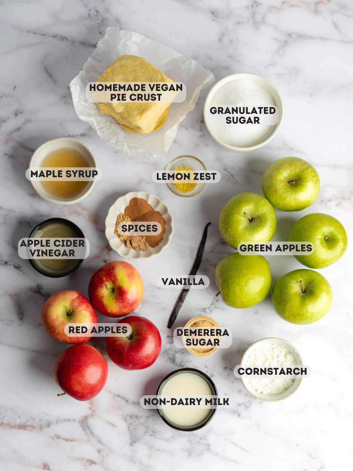 ingredients for apple pie measured out in bowls.