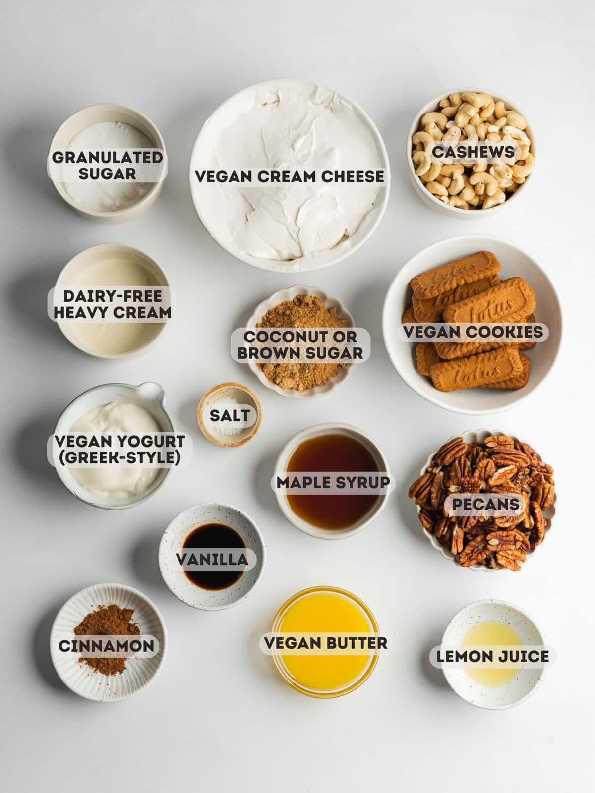 ingredients for pecan caramel cheesecake measured out in bowls.