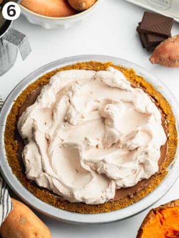 chocolate pie with cocoa whipped cream on top.