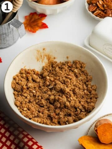pecan streusel topping in a ceramic mixing bowl.