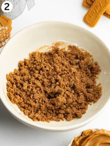 biscoff spread crumble mixture in a ceramic bowl.