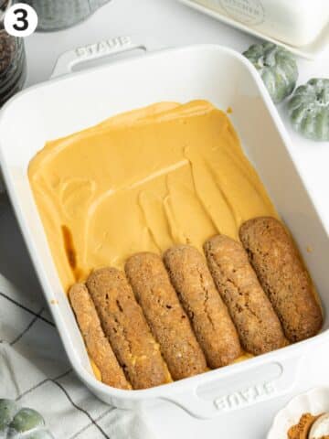 layering pumpkin tiramisu with soaked ladyfingers.