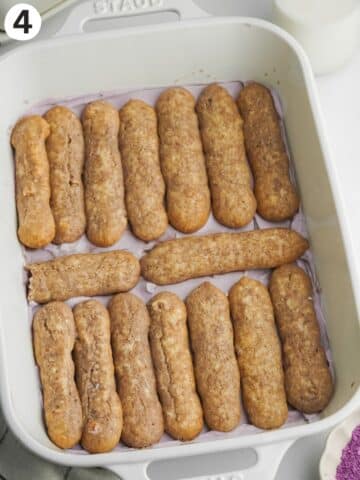 a layer of espresso dunked ladyfingers in a baking dish.