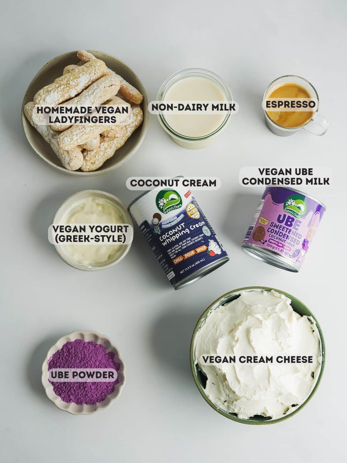ingredients for ube tiramisu measured out in bowls on a gray surface.