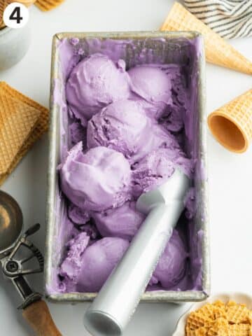 scoops of ube ice cream in a loaf pan.