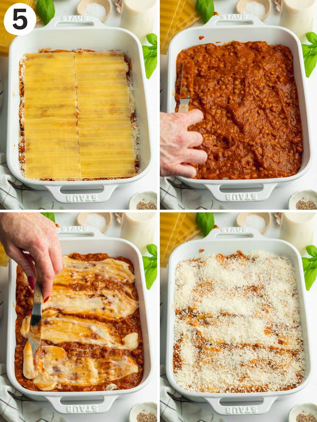 adding the final layer of lasagna components to a white staub pan.