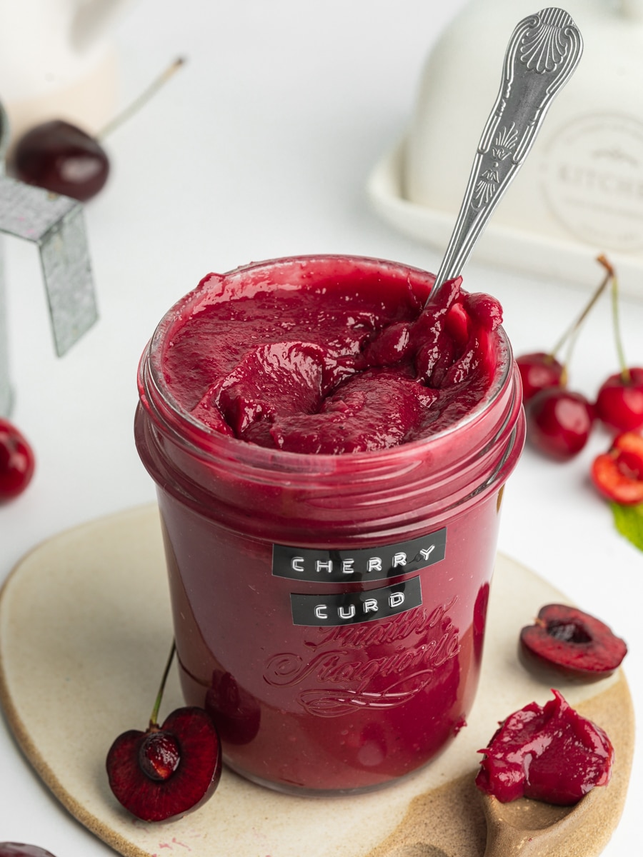 a jar of thick homemade cherry curd.