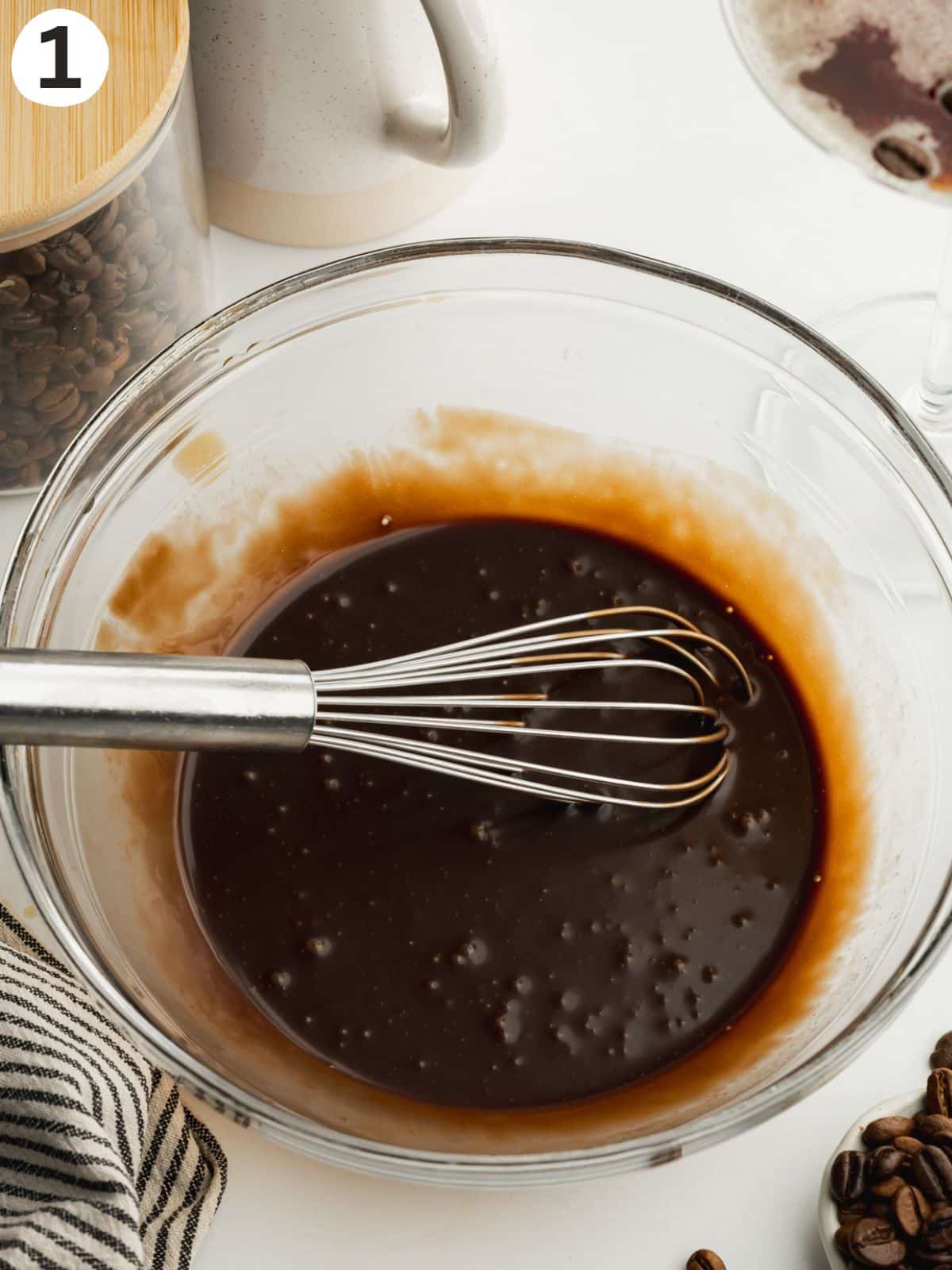 a bowl with chocolate fudge sauce mixed together with coffee liquer. 