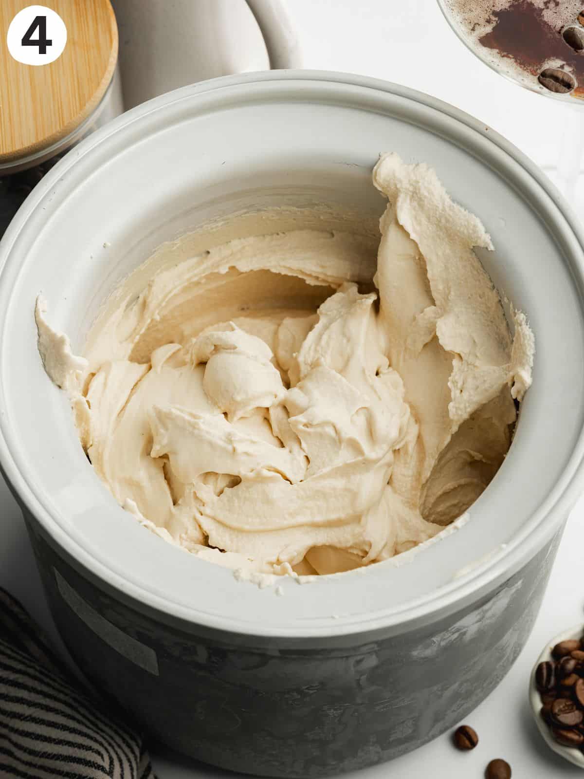 freshly churned espresso ice cream in an ice cream maker bowl.