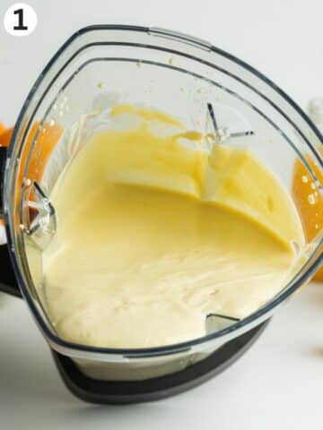 creamy orange mascarpone mixture blended in a blender jug.
