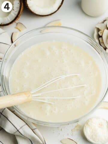 coconut triple milk mixture whisked in a glass bowl.