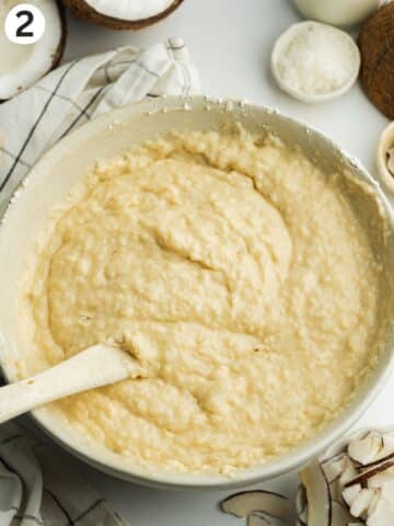 coconut tres leches batter mixed in a large ceramci bowl.
