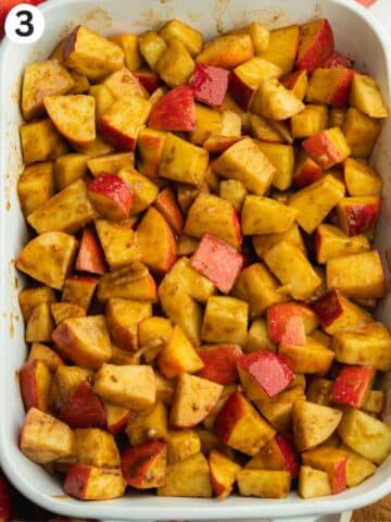 coated apple chunks in a ceramic dish.